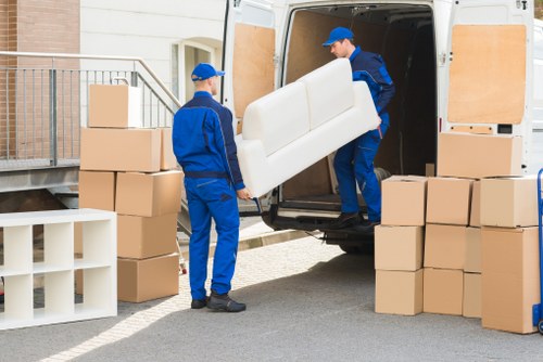 Packed moving boxes and furniture prepared for transport in Lambeth