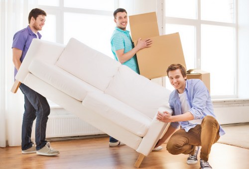 Local moving team transporting boxes and furniture across Lambeth
