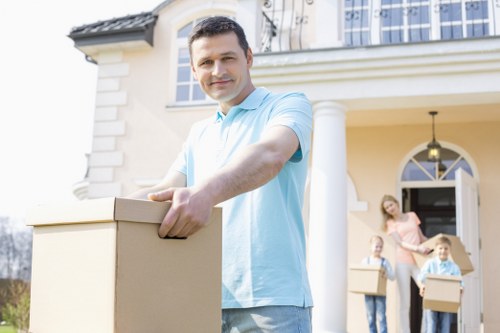 Packed household boxes and furniture prepared for a local home move