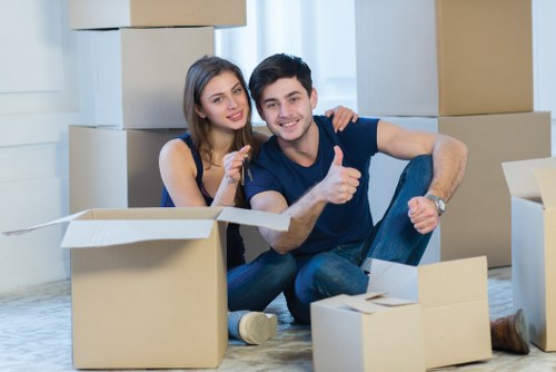 Boxes and small furniture prepared for student moving day in South London