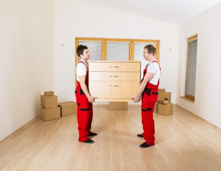Local movers handling a same-day property move near a busy Lambeth street